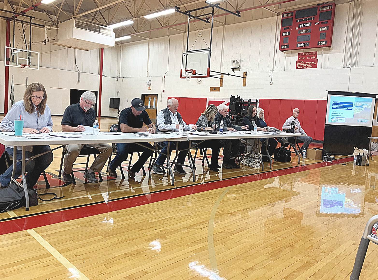 The members of the Ross Lake Improvement Board contemplate a weed remediation plan that they eventually rejected at a meeting last Wednesday night.