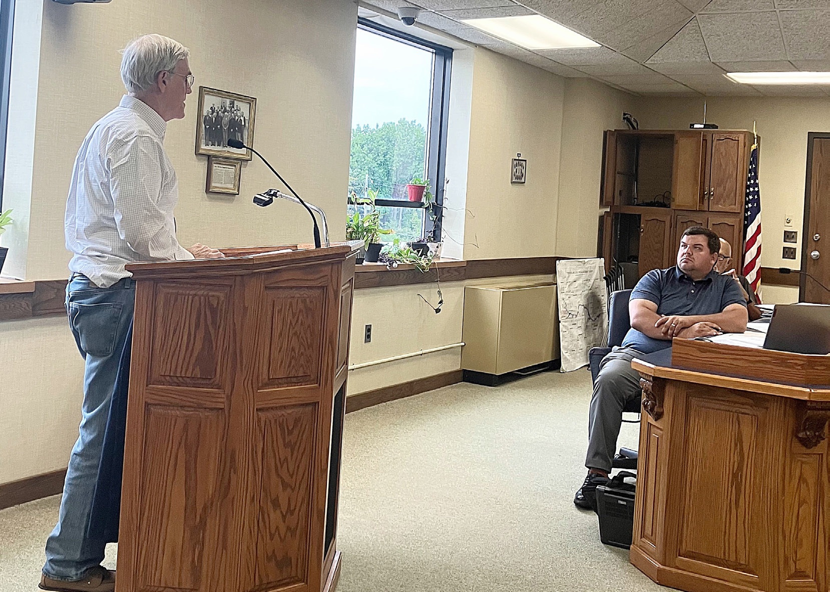 Wade Trim Planner, Arthur Mullin, discusses the draft of the Master Plan with County Commissioner Alan Donaldson at Tuesday’s board meeting.