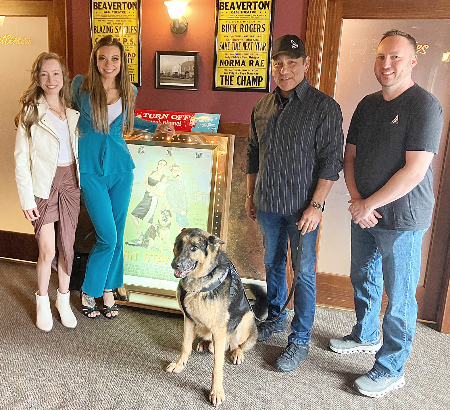 Actors Amy Stecker and Rynn Rosa pose with Little Chief, Producer/Animal Wrangler Joaquin Guerrero and Producer Taylor Gradowski in the lobby of the Gem Theater in Beaverton Saturday prior to a showing of their new movie “Sit Stay Heal.”
