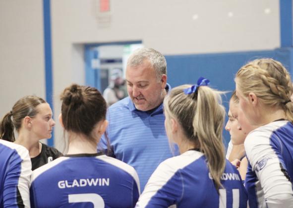 Gladwin coach Tony Wetmore talks strategy with the troops during a break in the action.