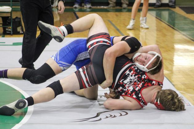 Gladwin’s Braden Ritchie puts the pressure on Beaverton’s Justin Wood. Ritchie was First Team All-Conference at 190 and Wood was Second Team.