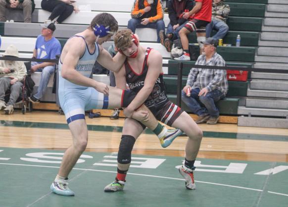 Beaverton Second Team All-Conference honoree Justin Wood gets a leg up on a Meridian opponent at the league meet at 190.