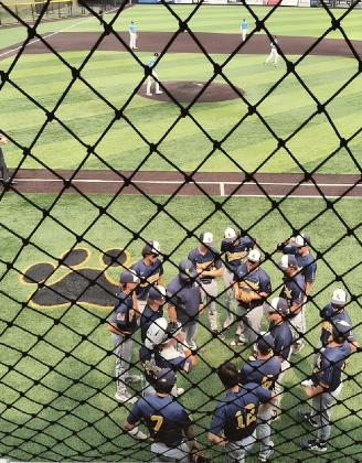 Coach Merillat gives team pep talk prior to the sixth inning rally when Linwood took a 3-2 lead.