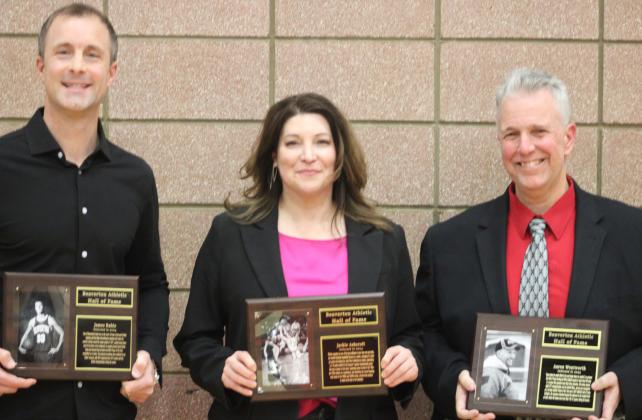 The latest inductees into the Beaverton Hall of Fame (left to right) James Ruhle, Jackie Wheeler and Aaron Wentworth pose with their plaques on Hall of Fame Night at the school’s gym.