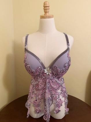 The “I am a Survivor,” donated and decorated by Cynthia Miller, a member of the Sugar Springs Stitchers, and a Detroit sports theme bra, “Lions, Tigers &amp; Wings, Oh My!,” created by Jaye Smith of Gladwin, are two of the many bras that will be auctioned off during the fundraising event.