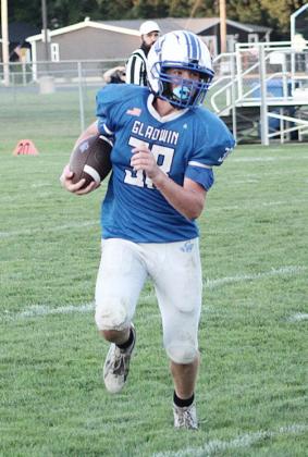 Jackson Fritz carries the ball for the Gladwin junior varsity football team during a recent game.