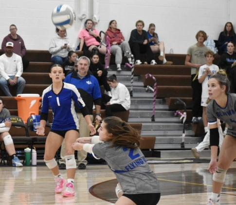 Gladwin’s Peyton Hillier keeps the ball off the floor during a recent match. The Flying G’s beat Standish and Farwell last week for third place in the Jack Pine Conference.