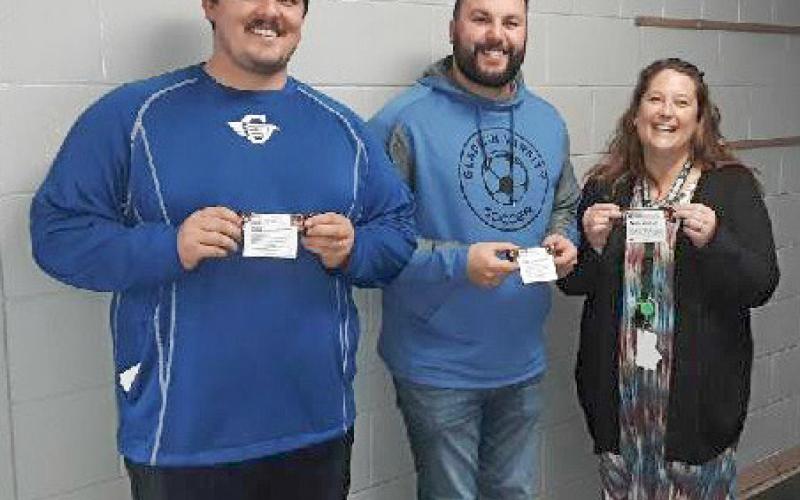 Gladwin Intermediate School teachers, Ethan Gary, Dominic Lake, and Sofia Kruske, hold the candy bars of appreciation they received from MARSP-Gladwin County Chapter.
