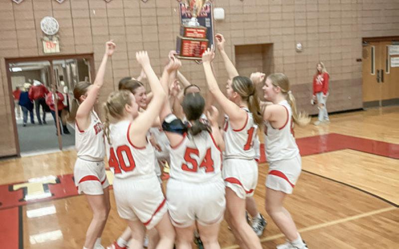 Beaverton celebrates with the Cedar Cup after beating Gladwin last Wednesday.