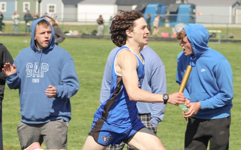 Gladwin’s Myles Robinson opens up a lead running the second heat of the 1600 relay Saturday at the Jack Pine Conference Meet at Pinconning.