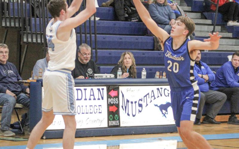 Gladwin’s Brody Verellen applies defensive pressure during last Wednesday’s season-opener at Meridian.