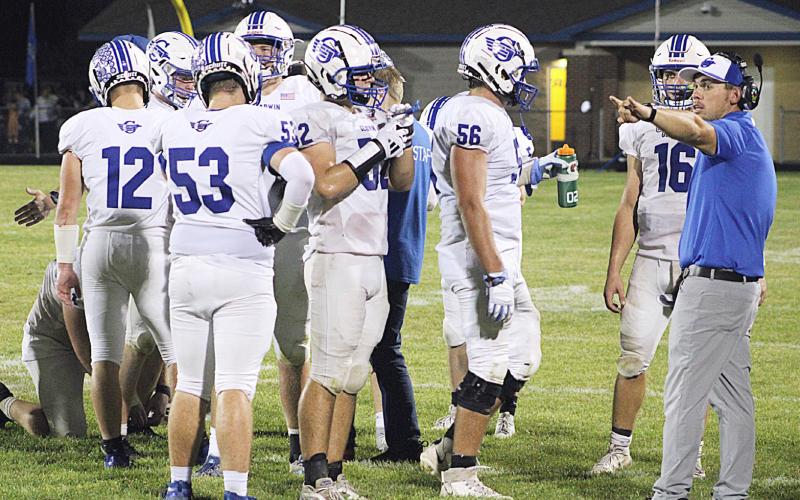 Kody Emeott calls the shots during a time out last season. Emeott has moved up from Defensive Coordinator to Head Coach and will lead the Flying G’s for the first time Friday night at Flat Rock.