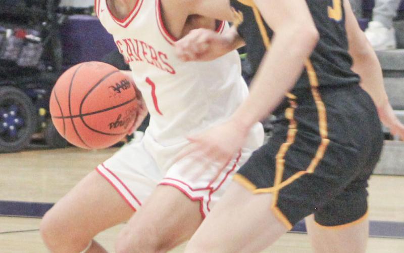 Beaverton’s Sean Barta slams on the brakes and checks his options during last week’s district semifinal victory over Evart at Farwell.