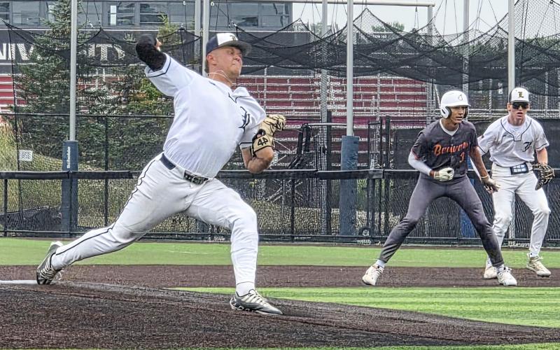 Mason Meier delivers a pitch versus the Beavers in the Panther Classic. Beaver player Garrison Zuker leads off first base as Bryce Neitzel looks on. GRAND RAPIDS