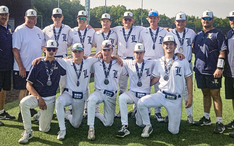 Linwood Post 239 – Davenport University Panther Classic Runners Up. Pictured in front row: Robby Mularz, Dane Anderson, Jack Berthiaume, Kole Wilson, and Caleb Emans; back row: coach, Scott Brokoff; coach, Terry Brokoff; Bryce Neitzel, Connor Ritchie, Westyn Bryant, Kaden Gerzseny, Nick Naylor, Mason Meier, coach, Hunter Merillat; and coach, Josh Higgins.