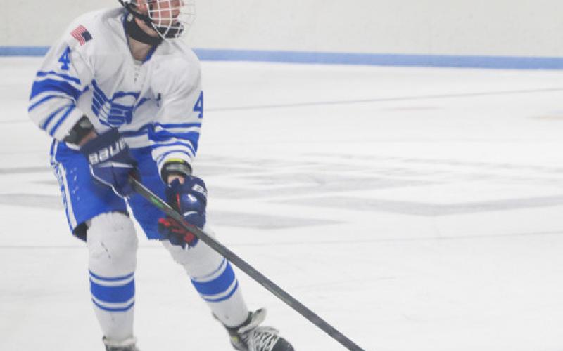 Gladwin’s Ike Wheeler crosses the blue line during Saturday’s win.