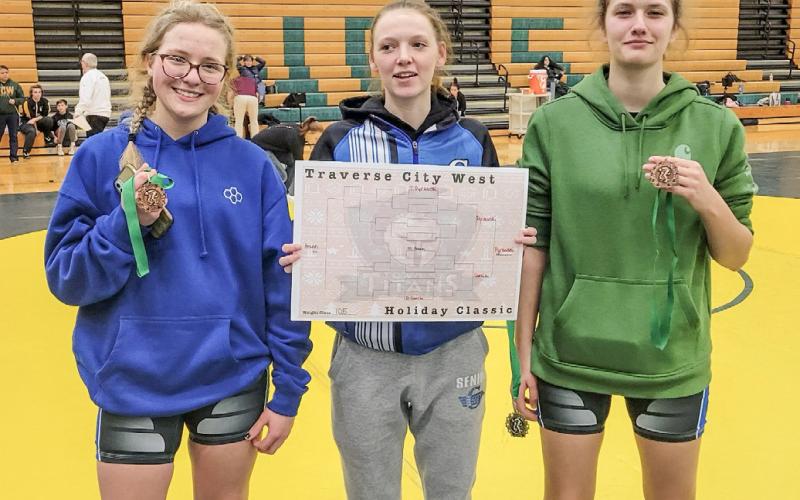 Gladwin’s (left to right) Jade Sheltraw, Tricia Pyrzewski and Charlotte Mawhorter show off their awards after competing at a girls’ only invitational at Traverse City West last week.