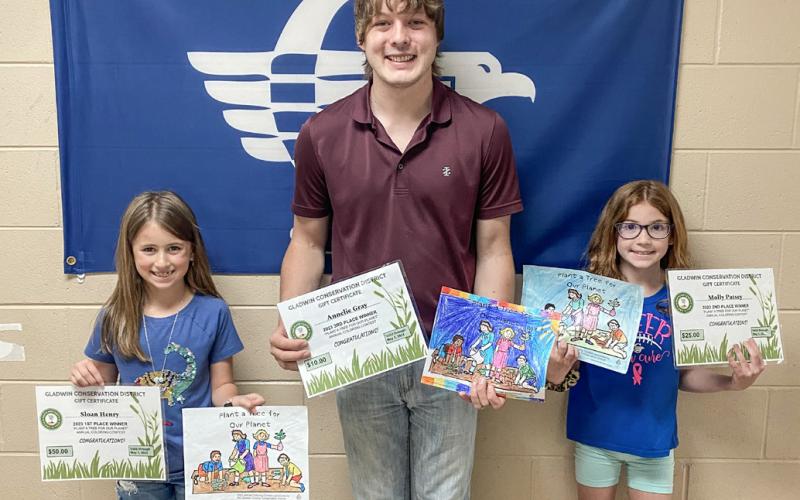 Tristan Hewitt is pictured with Sloan Henry and Molly Patsey.