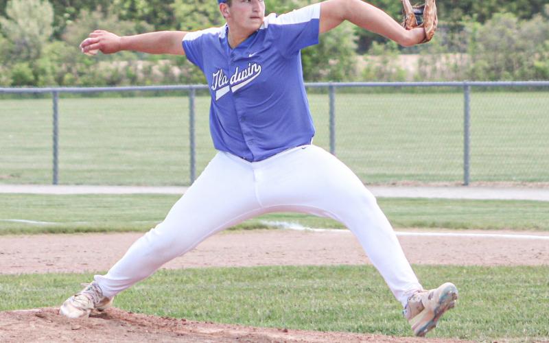 Gladwin starting pitcher Brayden Dee fires during Saturday’s loss to Ogemaw Heights in the Division 2 District Tournament at Standish.