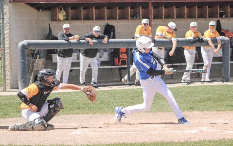 Gladwin’s Logan Walters rips a single during Saturday’s loss to Ogemaw Heights in the district semifinals at Standish.