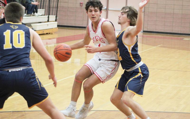 Beaverton’s Sean Barta tries to slip between two Standish defenders during Friday night’s loss to the Panthers. SCOTT SALOWICH