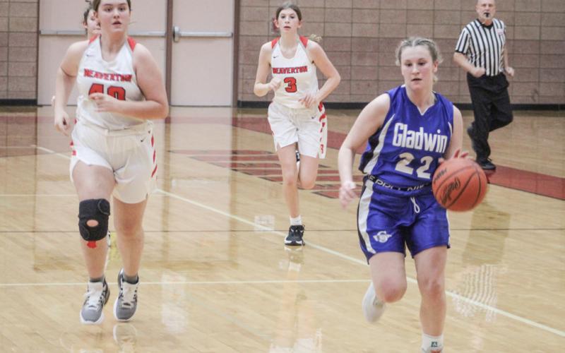 Gladwin’s Elizabeth Winchester runs the floor during the Flying G’s junior varsity victory Thursday night.