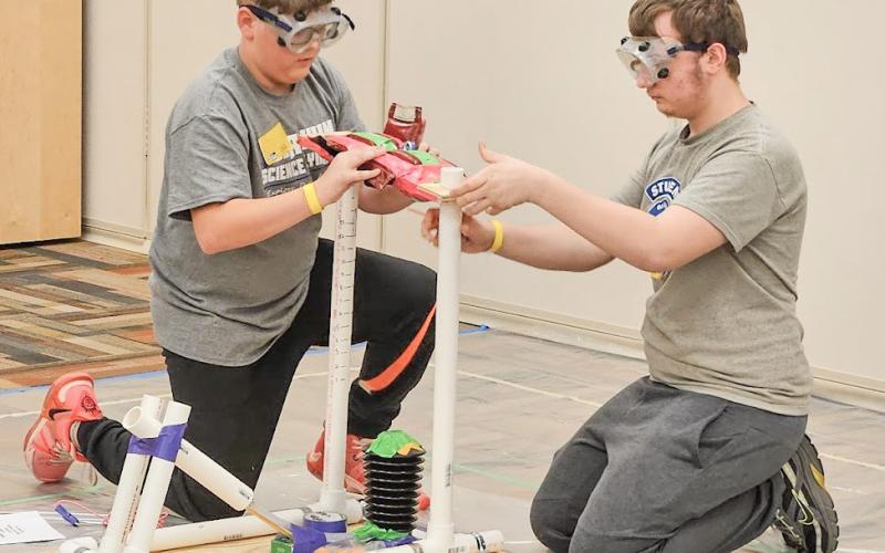 Owen Yancer and Issac Freisen with their Air Trajectory device, which successfully launched a ping pong ball to hit two targets three and six meters away.