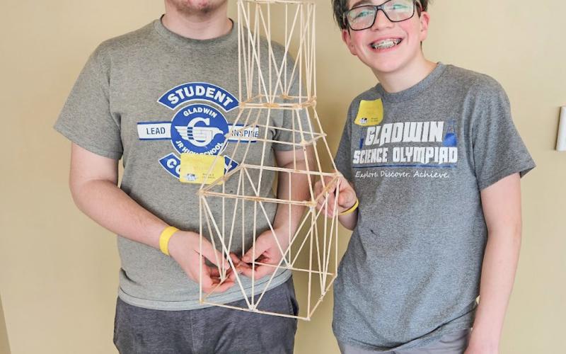 Isaac Freisen and Garrison Farley with the tower they built to hold 15 Kilograms, the tower only weighs 48 grams.