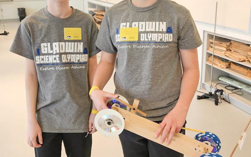 Ivan Christensen and Blake Verellen with their wheeled vehicle that was just centimeters away from the target distance.
