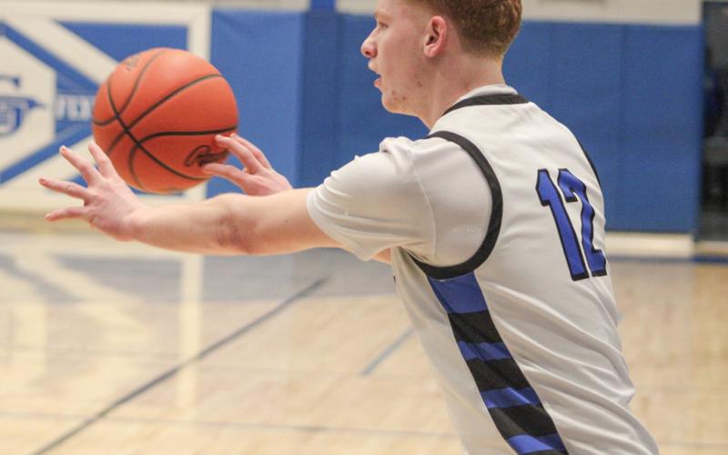 Bronson Bigham snaps off a pass to a teammate during Gladwin’s amazing 19-game winning streak.
