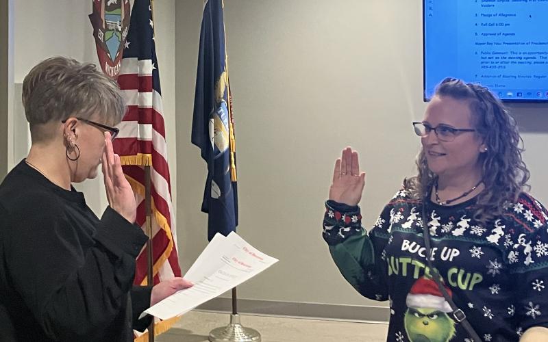 Beaverton City Manager Shannon Sirpilla swears in Council Member and Mayor Pro Tem Jennifer Harper.