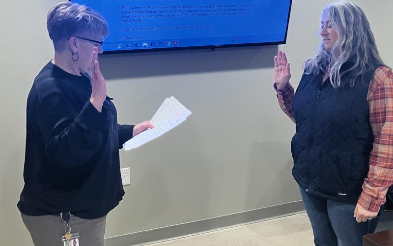 Beaverton City Manager Shannon Sirpilla swears in Council Member Missy Vulders to office at Monday’s City Council meeting.