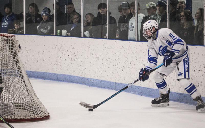 Gladwin’s Moe Newman controls the puck behind the net during a game earlier this season. The Flying G’s will play in a Division 3 regional final tonight in Saginaw.