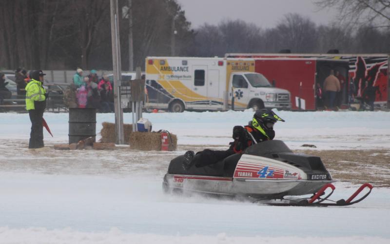 Harvey Zelt roars into a turn during the recent Vintage Snowmobile Race at the Gladwin County Fairgrounds.