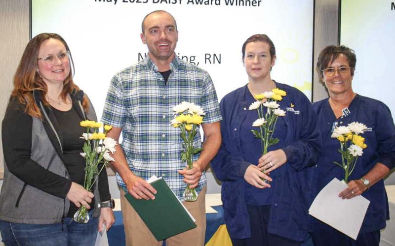 Nick King, R.N., MyMichigan Medical Center Gladwin, center, was one of 12 nurses across the MyMichigan Health system recently honored with The DAISY Award for Extraordinary Nurses. He stands with, pictured left to right: Ashley Scharf, R.N., Stacie Kellogg, R.N., Sharon McCauley, R.N., and Andrea Beecher, R.N.
