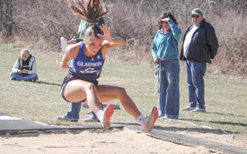 Gladwin’s Kamya Cajigas leaps to victory in the long jump last Wednesday at Clare.