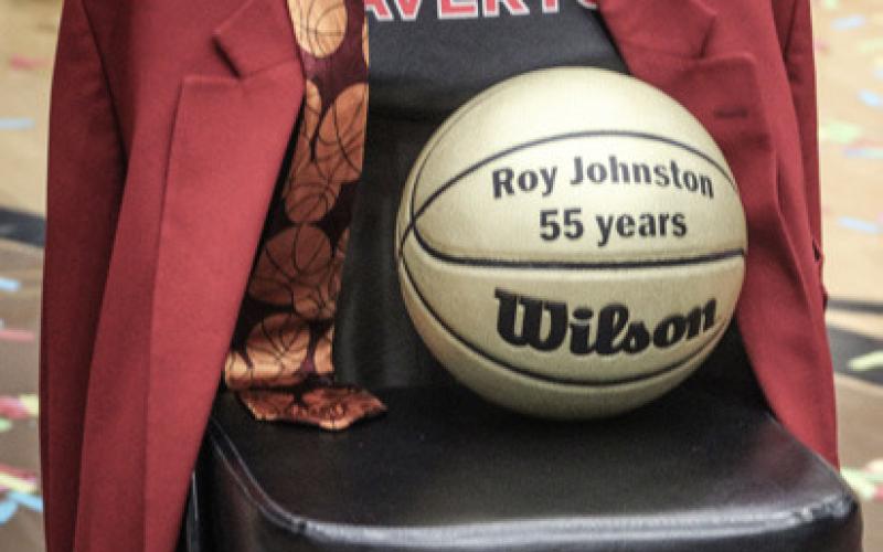 Beaverton’s Roy Johnston, the state’s all-time winningest high school basketball coach, celebrates as the horn sounds to end Friday night’s 54-45 victory over visiting rival Gladwin in his final home game.