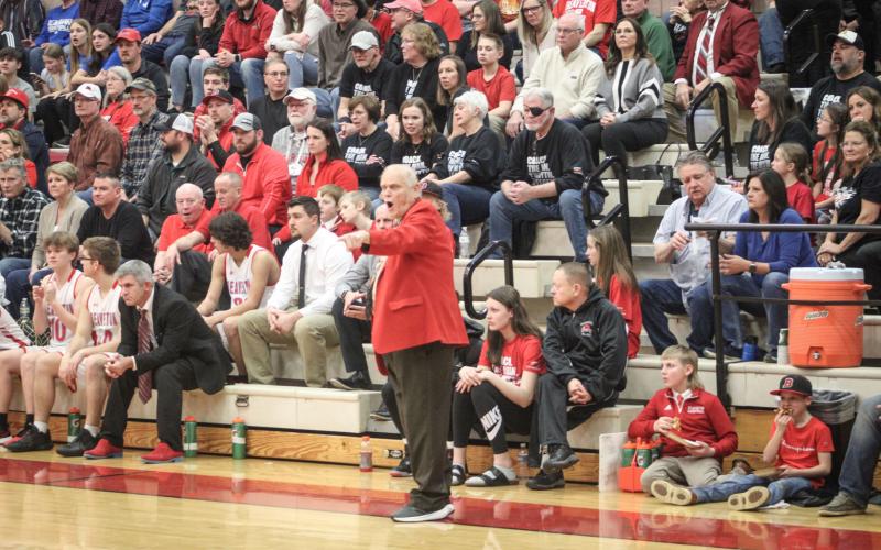 Coach Roy barks out orders from his familiar spot along the sidelines in front of a packed house at Beaverton Friday night in his final home game after 50 years at the helm.