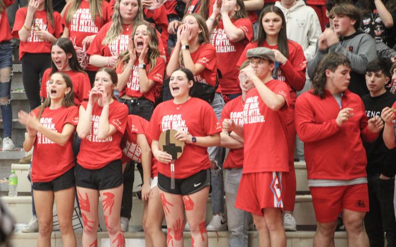 Beaverton’s “Bleacher Creatures” sport T-shirts honoring Roy Johnston in his final home game and shout encouragement to his team Friday night.
