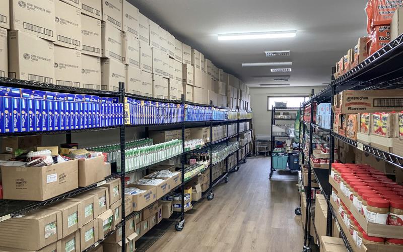 The new shelves in the new pantry are packed with goods to help feed the hungry after the completion of the expansion of Sacred Heart Mission.