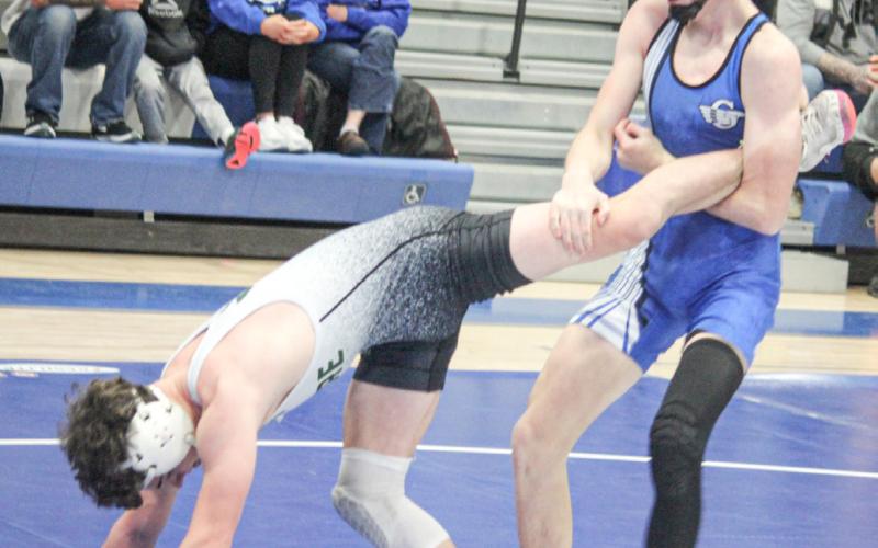 Gladwin’s Ethan Palmateer locks up a leg during Thursday’s team district tournament. Palmateer went on to win an individual district championship Saturday.