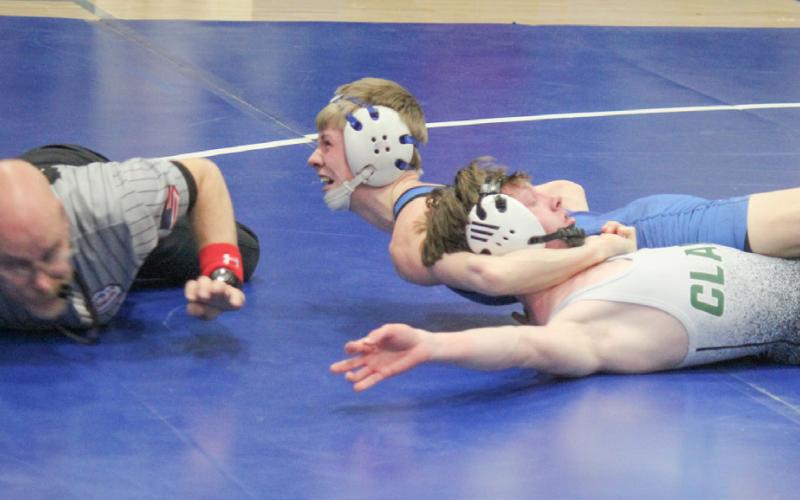 Gladwin’s Brady Demory scores a pin during Thursday’s team district tournament loss to Clare. Demory was the individual district champ at 113 on Saturday.