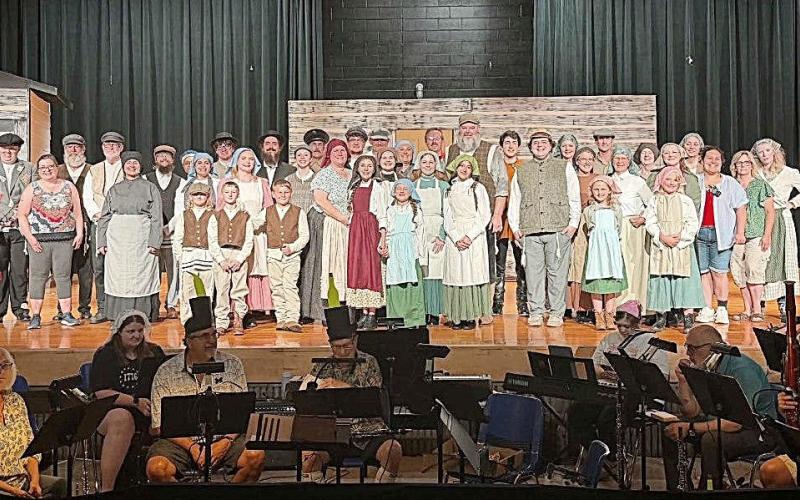 Cast and crew of Fiddler On The Roof with the orchestra on a rehearsal night.