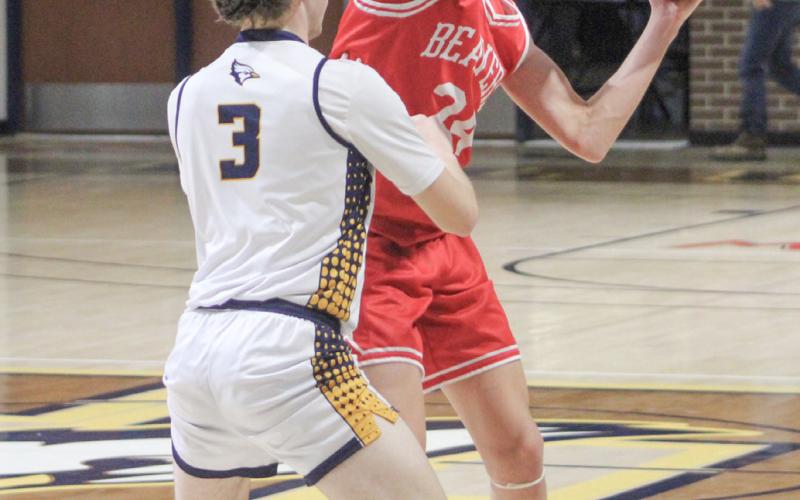 Beaverton’s Jace Mishler gets ready to feed the post during Thursday night’s victory at Shepherd.