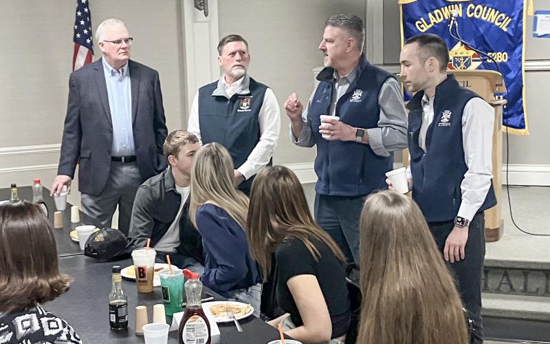 State Representative Mike Hoadley, flanked by State Senator Roger Hauck and State Representative Bill G. Schuette, talks shop with members of the Gladwin County Youth Leadership Program at Friday’s Legislative Breakfast.