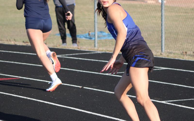 Gladwin’s Austin McCormack gets ready to take the baton during the 800 relay at last Wednesday’s meet.