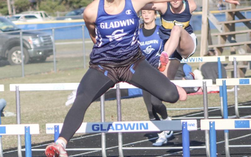Gladwin’s Bree Visser clears a hurdle during last Wednesday’s Jack Pine Conference opener against Shepherd and St. Louis.