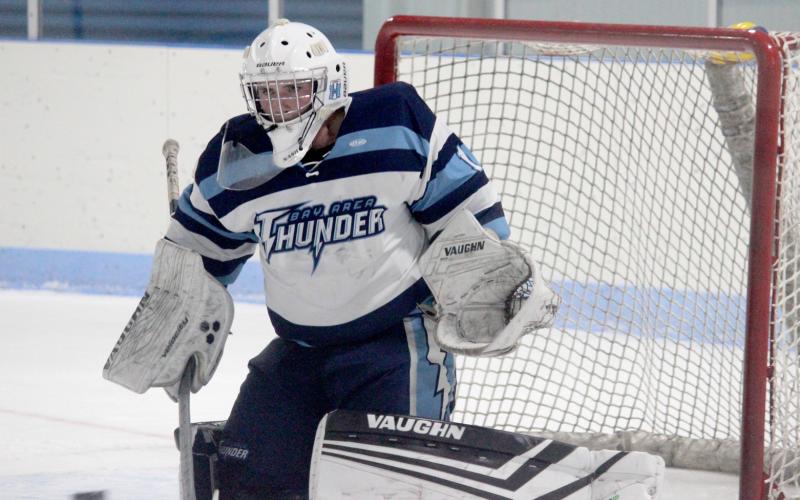 Trenton Reid defends the net against Bishop-Foley.