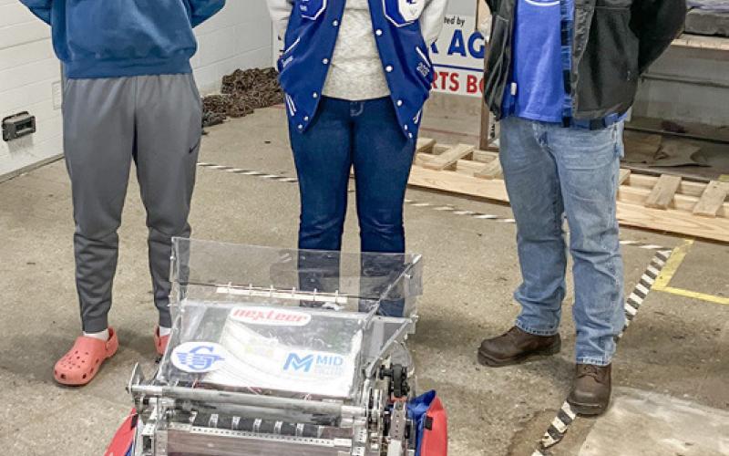 The high school robotics teams and their mentors from Beaverton and Gladwin (inset) gathered Saturday at Beaverton Elementary School to receive the equipment and instructions they need to prepare for this year’s competitions.