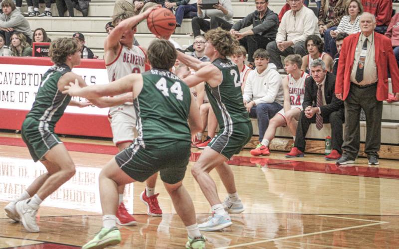 Beaverton’s Caiden Loar runs into a brick wall of Pinconning defenders during Thursday night’s game.